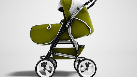 A green baby stroller with a white hood and black frame, four white wheels, and a soft, stylish design, set against a light background.