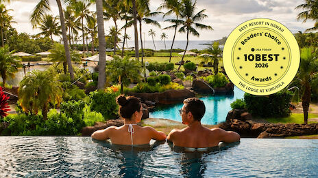 Two people relax in an infinity pool with a tropical resort, palm trees, and a lake/sea view; a Best Resort award sticker is on the top right.